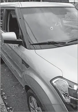  ?? [COLUMBUS POLICE] ?? A Kia Soul shows the bullet holes left by an unknown gunman fired at a Columbus police officer while he was speaking with the driver during a traffic stop in South Linden last week.