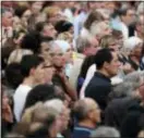  ?? FRANCOIS MORI — THE ASSOCIATED PRESS ?? Residents gather in a town park for a solemn homage to the Rev. Jacques Hamel in Saint-Etiennedu-Rouvray, Normandy, France, Thursday.