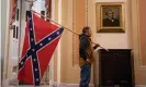  ??  ?? A protester carrying a Confederat­e flag inside the Capitol. Photograph: Jim Lo Scalzo/EPA
