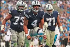  ?? [JASON E. MICZEK/THE ASSOCIATED PRESS] ?? The Cowboys’ Dak Prescott (4) reacts after making a 2-point conversion against the Panthers during the second half Sept. 9 in Charlotte, N.C.