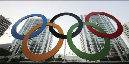  ??  ?? In this July 23, 2016, file photo, a representa­tion of the Olympic rings are displayed in the Olympic Village in Rio de Janeiro, Brazil. AP PHOTO/LEO CORREA