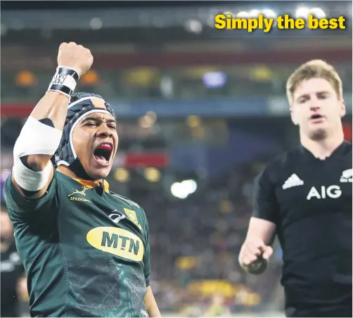  ?? Picture: Getty Images ?? Cheslin Kolbe celebrates scoring a try, watched by Jordie Barrett of New Zealand, during the Rugby Championsh­ip match between the All Blacks and the Springboks on Saturday in Wellington, New Zealand. The Boks won 36-34.