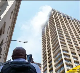  ?? Karen Sandison African News Agency(ANA) ?? Three firefighte­rs were killed and at least 13 others were rushed to hospital after the Bank of Lisbon building in central Joburg caught fire yesterday.