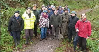  ??  ?? Ted Cook, Heritage Specialist; Danny O’Keeffe, NPWS Conservati­on Ranger and Conor Nelligan, Heritage Officer, present with a large group in Saint Gobnait’s Wood in Baile Mhúirne, to celebrate National Tree Week.