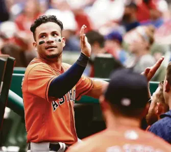  ?? Karen Warren / Houston Chronicle ?? Jose Altuve had three hits on Sunday and brings a .563 batting average into Monday’s home opener.