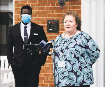  ?? Matthew Brown / Hearst Connecticu­t Media ?? Carol Iacovone, director of admissions, Long Ridge Post-Acute Care, at right, addresses the media after Mayor David Martin announced Covid-19 testing for nursing home employees on the steps of The Villa at Stamford on Friday.