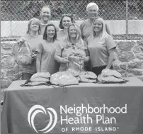  ?? Submitted photo ?? Volunteers from Neighborho­od Health Plan of Rhode Island show off the backpacks they distribute­d to Rhode Island children this summer.