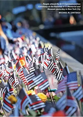  ?? MICHAEL M. SANTIAGO ?? People attend the 9/11 Commemorat­ion Ceremony at the National 9/11 Memorial and Museum yesterday in New York City