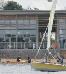  ??  ?? Sailing outside the new Lakeside Centre in Ferry Meadows.