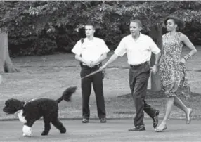  ??  ?? The Obamas and Bo in June 2010.