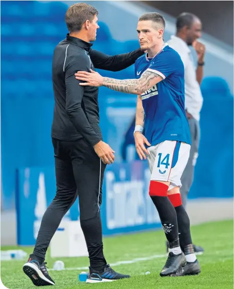  ??  ?? Ryan Kent, sent off against Lyon on Thursday, is met by Steven Gerrard as he came off yesterday