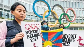  ?? FABRICE COFFRINI AFP VIA GETTY IMAGES ?? Tibetan activists protest in front of the Internatio­nal Olympic Committee headquarte­rs in Lausanne, Switzerlna­d, last week over February's Beijing 2022 Winter Olympics.