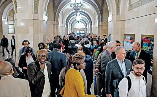  ?? BRIAN CASSELLA/CHICAGO TRIBUNE PHOTOS ?? People line up to meet Mayor Lori Lightfoot during an open house after her inaugurati­on.