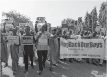  ?? AFOLABI SOTUNDE • REUTERS ?? Demonstrat­ors gather to urge authoritie­s to rescue hundreds of abducted schoolboys in Katsina, Nigeria on Thursday.