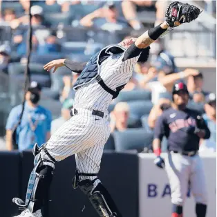  ?? JIM MCISAAC/GETTY ?? Yankees catcher Gary Sanchez misses a pop-up during the fifth inning against the Indians on Saturday in New York.