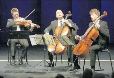  ?? Lawrence K. Ho
Los Angeles Times ?? L.A. PHILHARMON­IC cellist Robert deMaine, center, joins Jonathan Moerschel and Eric Byers, right, of the Calder Quartet during a sublime Schubert C-major Quintet at the Broad Stage in Santa Monica.