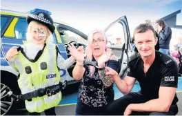 ??  ?? Under arrest Top cop Shannon Nicol arrests mum Sue with the help of PC