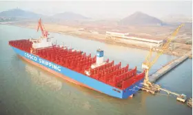  ?? AFP / Getty Images ?? A vessel sits in Nantong in China’s Jiangsu province. Exports are one of the strengths of the country’s economy.