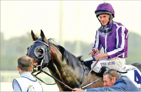  ?? AFP ?? Jockey Ryan Moore took control in the final furlong, forging past leader Cloak of Spirits.