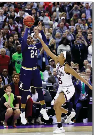  ?? AP/RON SCHWANE ?? Notre Dame’s Arike Ogunbowale makes the game-winning three pointer with 0.1 seconds left to lift Notre Dame to a 61-58 victory over Mississipp­i State in the NCAA Women’s Championsh­ip. Ogunbowale also made the game-winning shot in overtime Friday night...