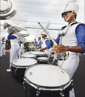  ?? The Maui News / MATTHEW THAYER photo ?? Maui High School’s marching band performs during the parade at the 96th Maui Fair in 2018. The school’s band director said the students will miss the time-honored tradition of marching in the parade preceding the fair, which organizers postponed again to 2023.