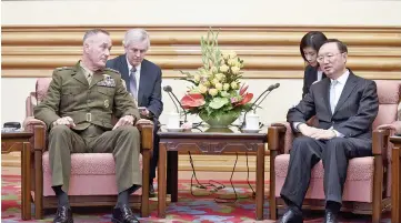  ?? — AFP photo ?? China’s State Councillor Yang Jiechi (right) speaks with Dunford (left) at the Zhongnanha­i Leadership Compound in Beijing.