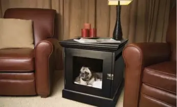  ?? DENHAUS PHOTOS ?? The TownHaus can fit small to extra-large dogs in stylish, indoor crates.