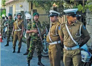  ??  ?? Security personnel stand guard near the Election Commission office in Colombo, before the arrival of President-elect Gotabaya Rajapaksa. —AFP