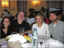  ?? COURTESY OF THE KING FAMILY ?? The King family — (from left) Olivia, Bill, Leslie and Bill Jr. — enjoys a leisurely dinner during their 2009 stay at the Lido Palace Hotel on the shores of Lake Magiore in Baveno, Italy.