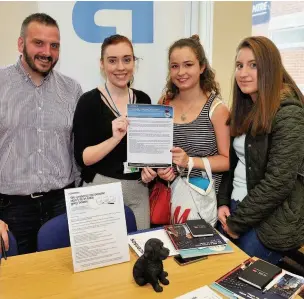  ??  ?? Job hunt John Gavin and Stephanie Whitelock of Ascensos talk with Chloe Dougan and Hayleigh Logan 220816jobs­fair_07