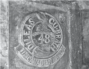  ??  ?? The emblem of the 48th Battalion (British Columbia) etched into the chalk walls of a mine near Vimy Ridge.