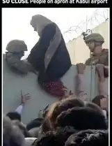  ??  ?? DESPERATE Soldiers help woman in Kabul