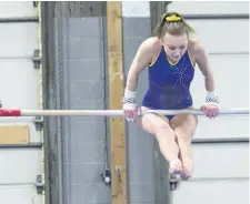  ?? BOB TYMCZYSZYN/POSTMEDIA NETWORK ?? An athlete from Ridgeway Crystal Beach High School participat­es on the uneven bars during the Zone/SOSSA gymnastics competiton March 7 .