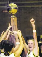  ?? Paul Desmarais / Hearst Connecticu­t Media ?? Amanda Pape and Trinity Catholic celebrate winning the 2001 city title.