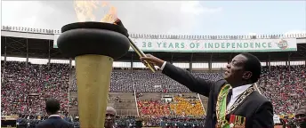  ??  ?? President Emmerson Mnangagwa lights the Independen­ce Flame at the National Sports Stadium in Harare yesterday