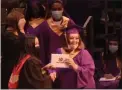  ?? PETE BANNAN - MEDIANEWS GROUP ?? Graduates receive diplomas as seen on the live stream video.