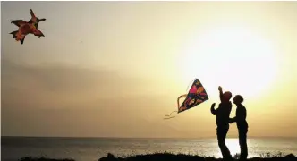  ??  ?? Men fly their kites during celebratio­ns of Orthodox Clean Monday in Ayia Napa in Cyprus yesterday. Cypriots traditiona­lly celebrate Clean Monday, the beginning of Lent in the Eastern Orthodox Church calendar, by eating seafood to signify a break with...