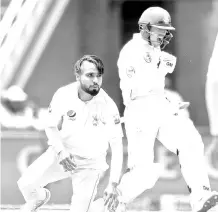  ??  ?? South African batsman Quinton de Kock (R) celebrates his century (100 runs) during the third day of the third Cricket Test match between South Africa and Pakistan at Wanderers cricket stadium in Johannesbu­rg, South Africa on January 13, 2019. - AFP photo