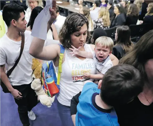  ?? CHIP SOMODEVILL­A / GETTY IMAGES ?? Representa­tives from faith and pro-immigratio­n groups walk out of a Senate Judiciary Committee hearing about the separation of children from their parents at the border on Capitol Hill on Tuesday in Washington, D.C.