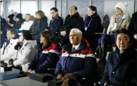  ?? PATRICK SEMANSKY — THE ASSOCIATED PRESS ?? Vice President Mike Pence, second from bottom right, sits between second lady Karen Pence, third from bottom left, and Japanese Prime Minister Shinzo Abe at the opening ceremony of the Winter Olympics.