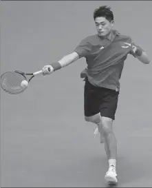  ?? XINHUA ?? Wu Yibing plays a forehand during last year’s Asian Games. Wu underwent surgery on his left foot in October, but was back in action on Sunday at a tournament in Houston, Texas.