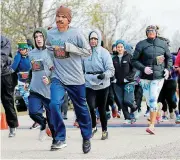  ?? [PHOTO BY NATE BILLINGS, THE OKLAHOMAN] ?? Runners start the YWCA’s Fearless K at Stars and Stripes Park in Oklahoma City.