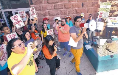  ?? ADOLPHE PIERRE-LOUIS/JOURNAL ?? New Mexico Dream Team member Felipe Rodriguez addresses a group of protesters at the Close The Camps rally, part of a nationwide event, in Albuquerqu­e on Tuesday.