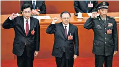  ?? ?? Li Shangfu, right, with fellow elected state councillor­s Qin Gang and Wu Zhenglong