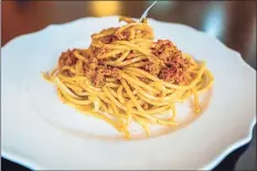  ?? Andrew Rush / TNS ?? Spaghetti served with piquant sun-dried tomatoes and pistachio pesto.