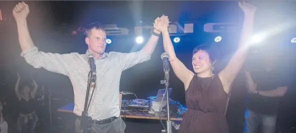  ?? LIAM RICHARDS ?? Charlie Clark and his wife, Sarah Buhler, celebrate with supporters Wednesday after he was elected Saskatoon’s mayor. Clark won in 41 of 62 polling stations on election day.