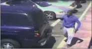  ?? LOS ANGELES POLICE DEPARTMENT VIA AP ?? This Oct. 1, 2016 frame from security camera video, released by the Los Angeles Police Department and posted on its website on Oct. 4, shows a suspect holding what appears to be a gun in the moments before he was fatally shot by officers in a police...