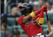  ?? JOHN BAZEMORE — THE ASSOCIATED PRESS ?? Atlanta Braves’ Ronald Acuna Jr. watches his double during the first inning of the team’s baseball game against the Pittsburgh Pirates on Friday in Atlanta.