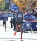  ?? SETH WENIG/AP ?? Lelisa Desisa, of Ethiopia, crosses the finish line first in the men’s division of the New York City Marathon on Sunday in New York.