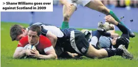  ??  ?? > Shane Williams goes over against Scotland in 2009